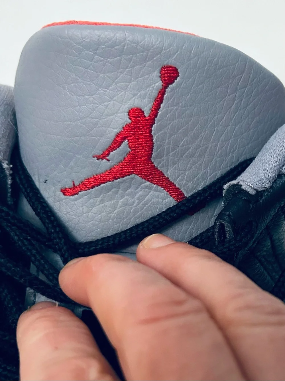 Air Jordan 11 Retro Low IE‎ Men's Black/Grey Sneakers with Red Jumpman Accents